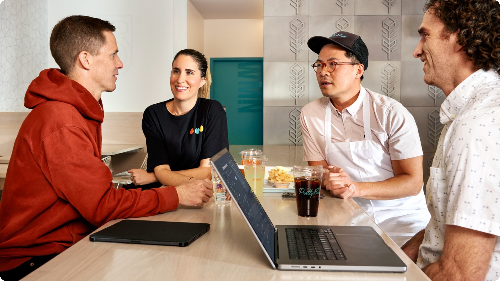 A merchant team operating commerce tools at a counter